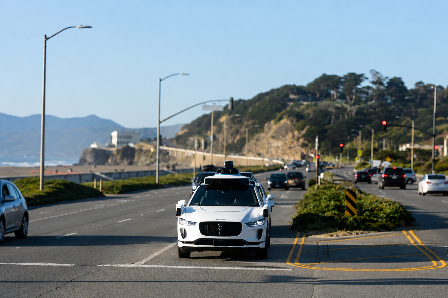 A white SUV navigating a busy road filled with other vehicles and traffic.