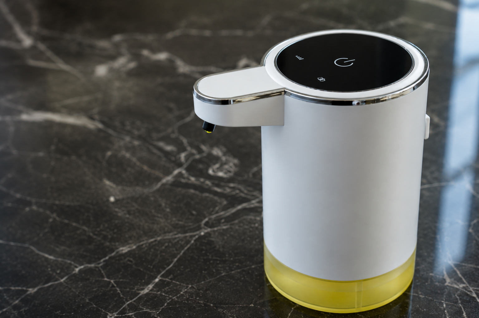 A white and yellow liquid dispenser placed on a marble countertop, showcasing its sleek design and functional purpose.